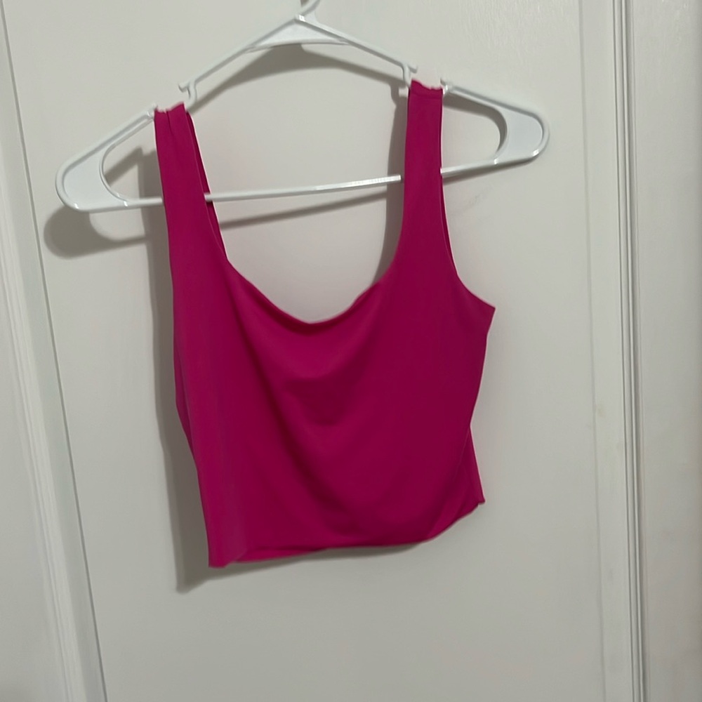 Hot pink crop top.